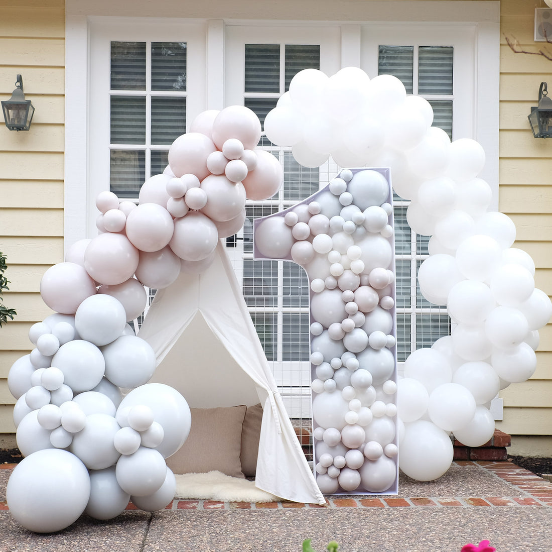 A colorful balloon garland party backdrop
