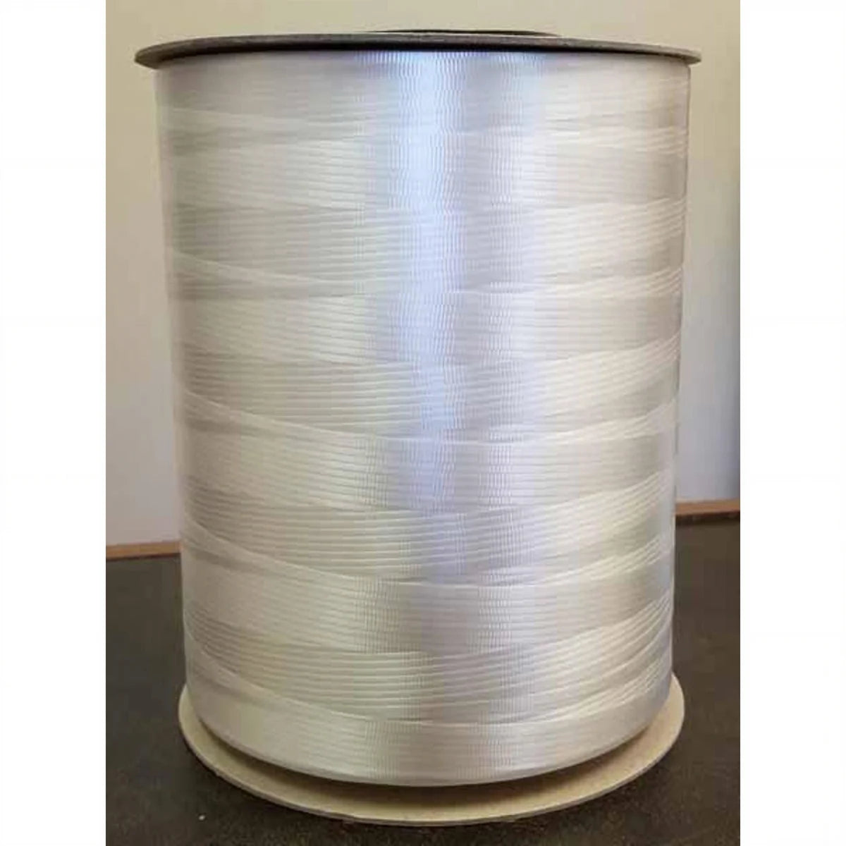 Large spool of white curling ribbon for party decorating
